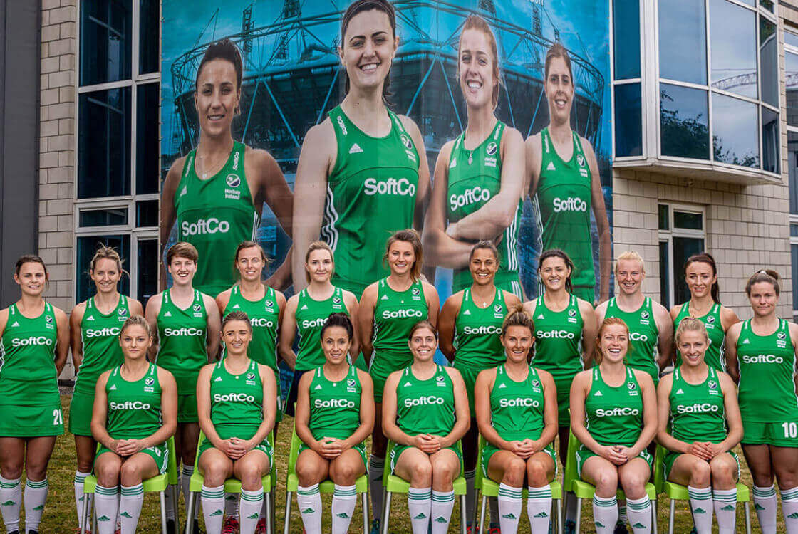 Irish women's hockey in front of SoftCo building